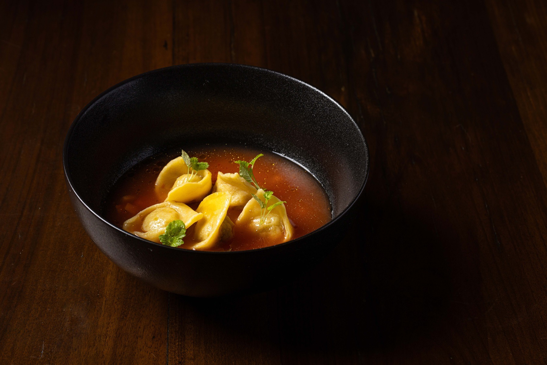 Steamed tortelli in capon broth