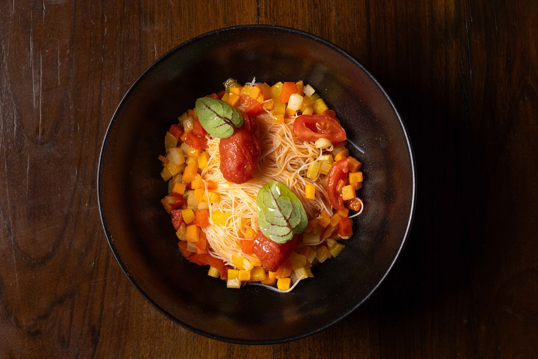 Soy noodles with mixed vegetables and datterini tomatoes